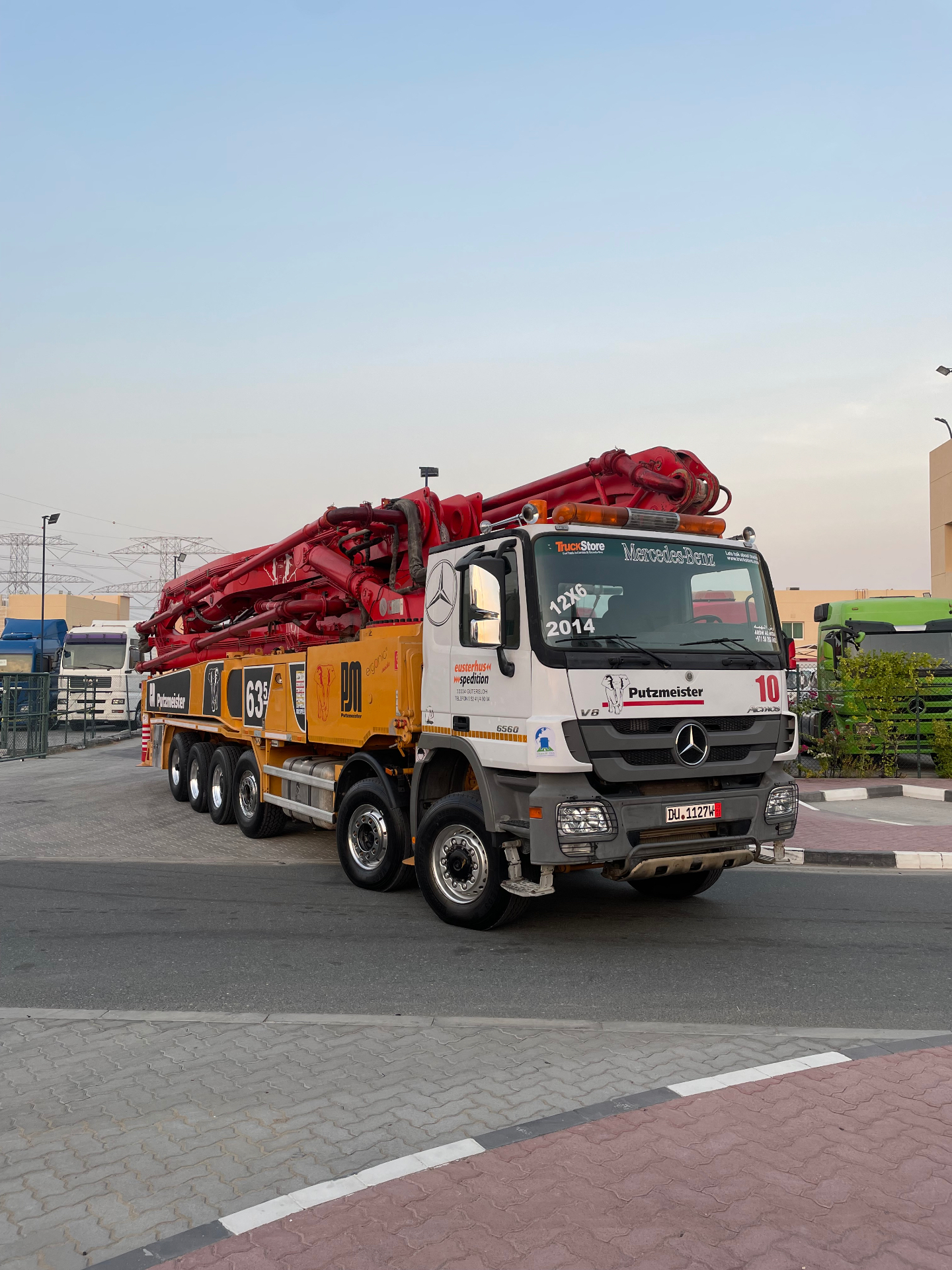 Mercedes-Benz Actros 6560 12x6 Putzmeister 63m concrete pump at sunset